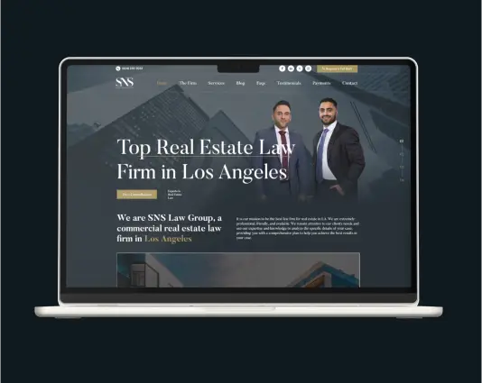 Laptop mockup displaying the SNS Law Group website homepage with the headline "Top Real Estate Law Firm in Los Angeles" and two attorneys standing in suits.